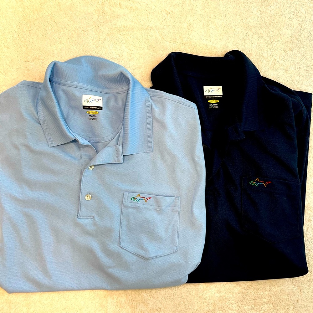 Greg Norman -two- shirts for sale; short sleeve, left pocket; light blue & navy